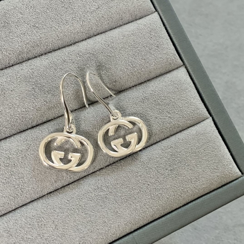 G*u*i earrings